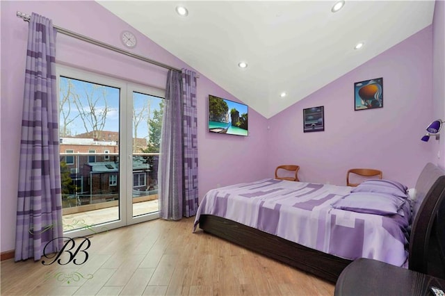 bedroom with access to outside, light hardwood / wood-style floors, and vaulted ceiling