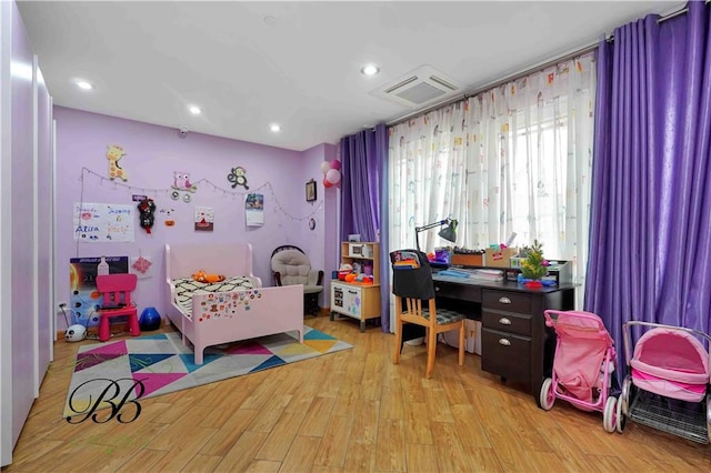 bedroom featuring light hardwood / wood-style flooring