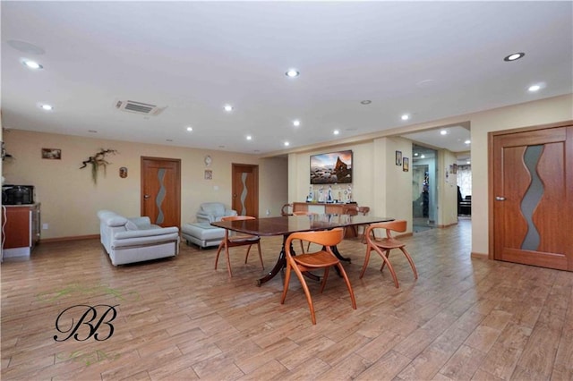 dining area with light hardwood / wood-style flooring