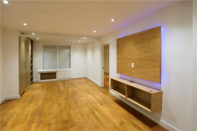 unfurnished living room with light wood-type flooring