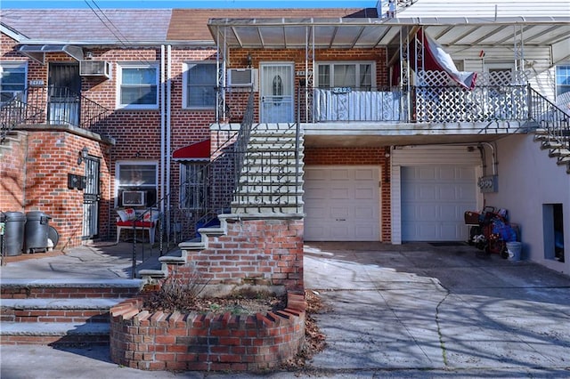 multi unit property with a balcony and a garage