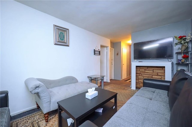 living room with carpet flooring and a fireplace