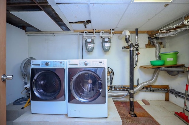 laundry room with washing machine and clothes dryer