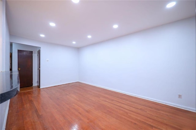 spare room featuring hardwood / wood-style flooring