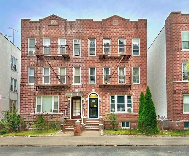 townhome / multi-family property featuring brick siding