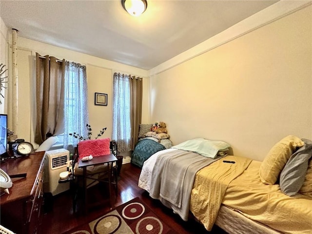 bedroom featuring wood finished floors