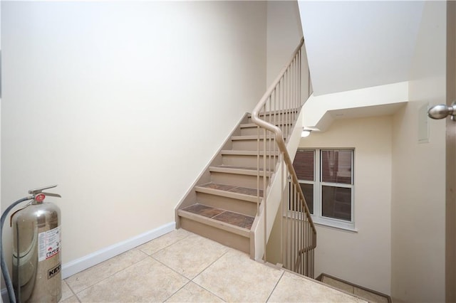 stairway featuring tile patterned floors