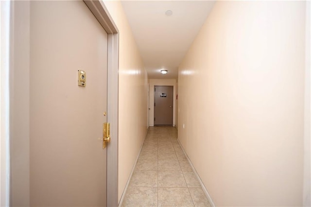 corridor featuring light tile patterned flooring