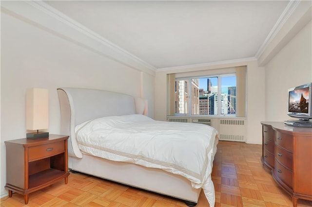 bedroom with ornamental molding and radiator