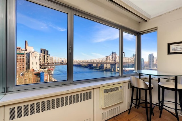 kitchen featuring a water view, radiator heating unit, and a view of city