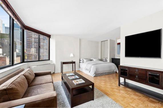 bedroom featuring light parquet flooring and multiple windows