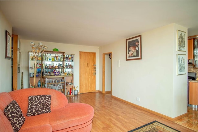 living room featuring bar and wood-type flooring