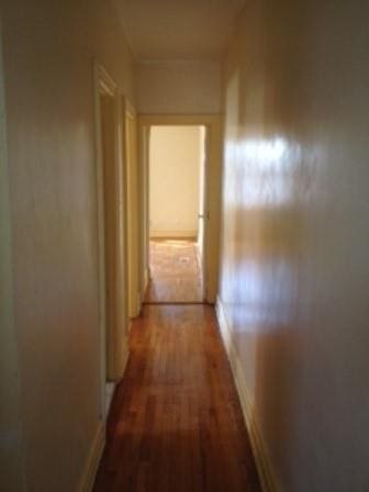 hall with dark hardwood / wood-style floors