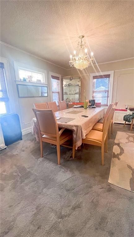 carpeted dining room with crown molding, an inviting chandelier, and a textured ceiling