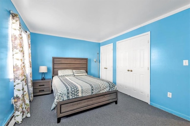 carpeted bedroom featuring baseboard heating and crown molding