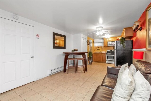 tiled living room featuring ceiling fan