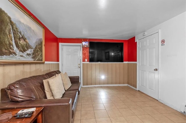 living room with light tile patterned floors and baseboard heating