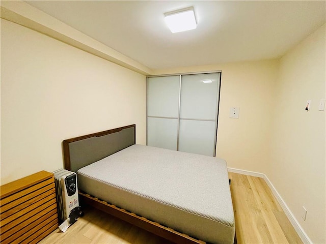 bedroom with hardwood / wood-style floors