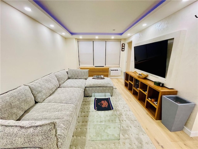 interior space featuring a wall mounted AC, wood finished floors, and recessed lighting