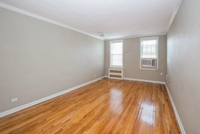 6665 Colonial Rd Unit 2F, Brooklyn, NY 11220 - unfurnished room featuring crown molding, baseboards, light wood-style floors, and cooling unit