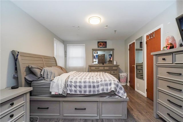 bedroom featuring dark hardwood / wood-style flooring