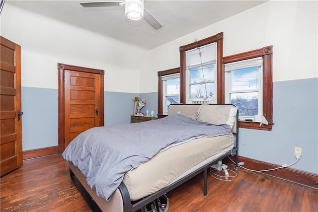 bedroom featuring dark hardwood / wood-style flooring and ceiling fan