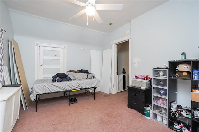 bedroom with lofted ceiling, carpet floors, and ceiling fan