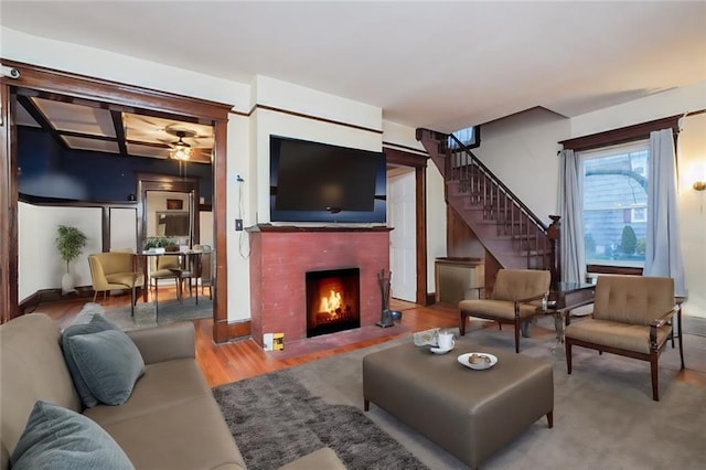 202 Watchogue Rd, Staten Island, NY 10314 - living area with ceiling fan, wood finished floors, a brick fireplace, and stairway