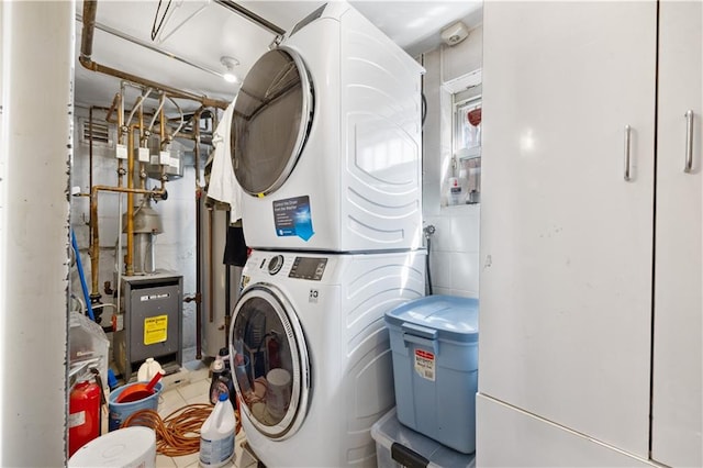 clothes washing area with stacked washer / drying machine