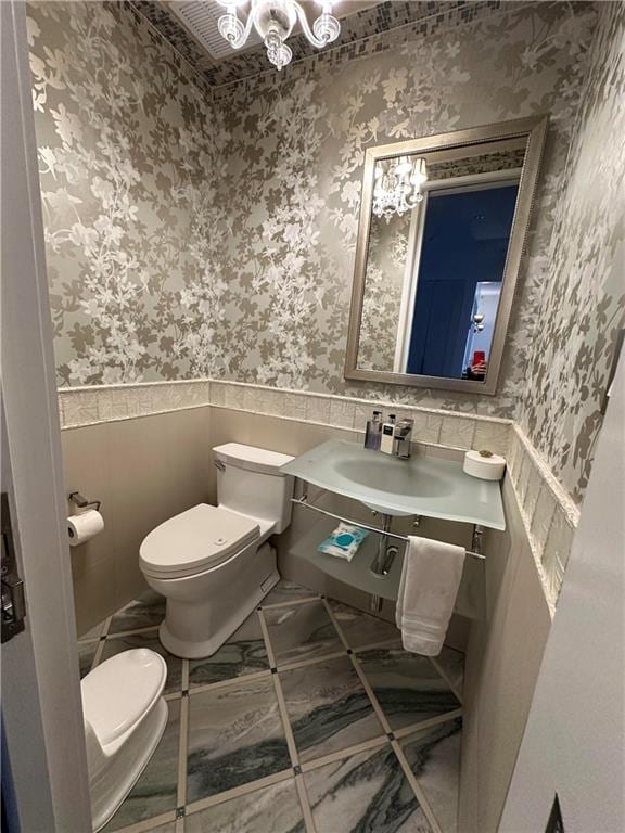 bathroom with sink and toilet