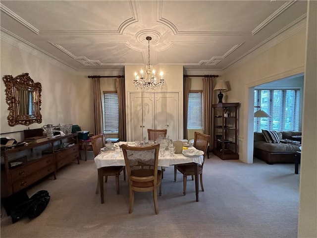 carpeted dining space featuring ornamental molding and a chandelier