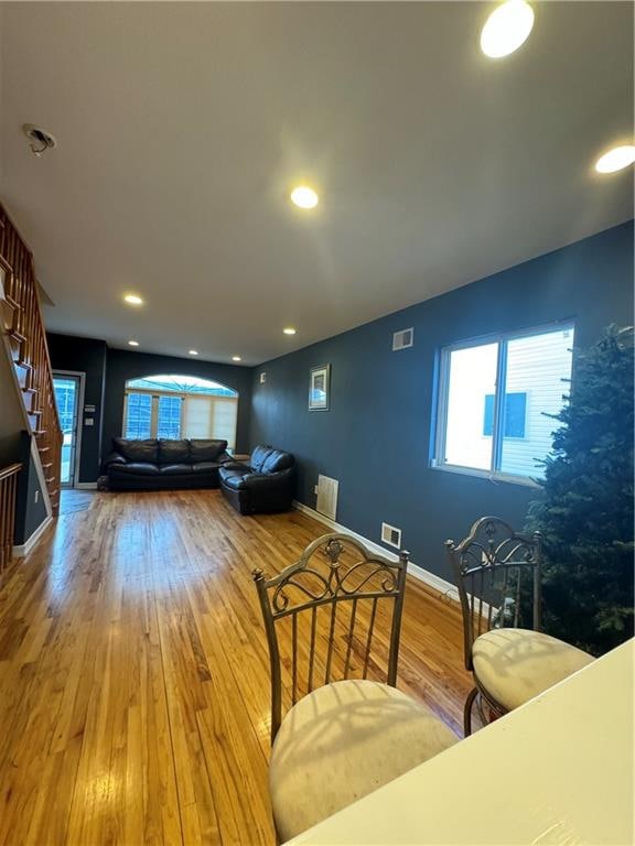 unfurnished living room with hardwood / wood-style flooring