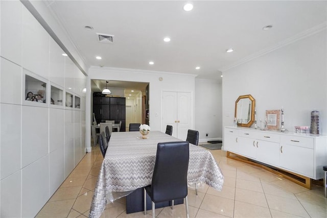 tiled dining space with ornamental molding