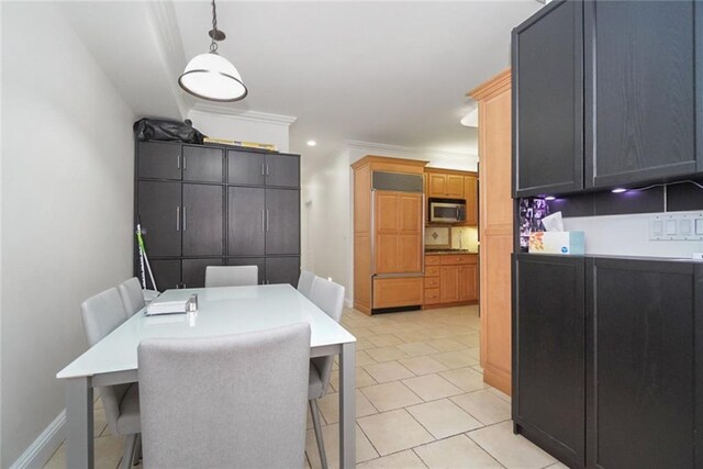 dining area with crown molding