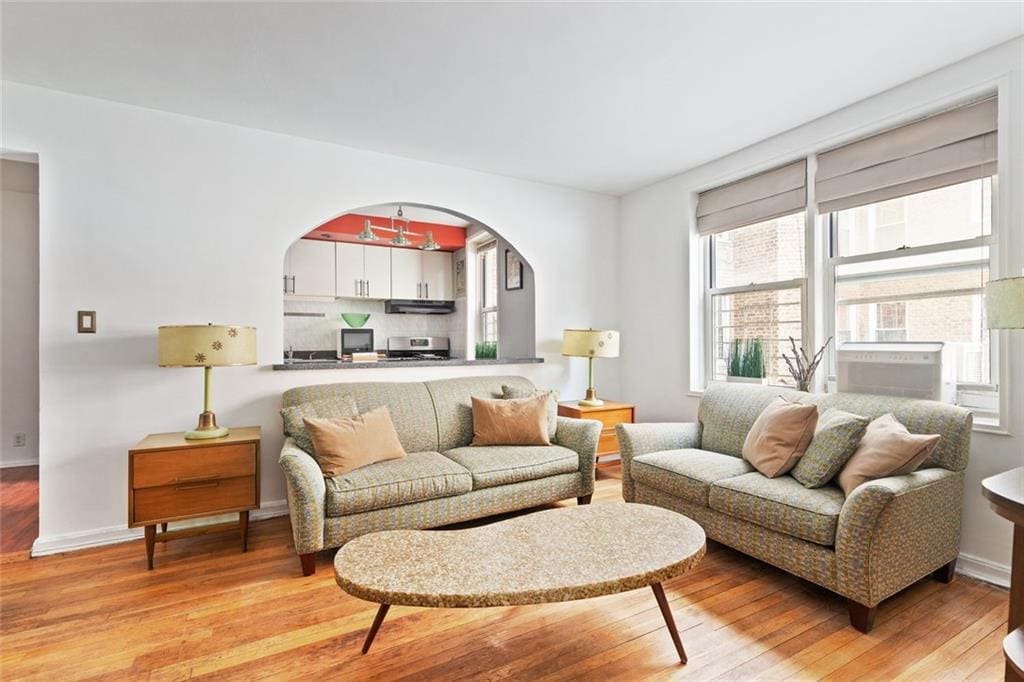 living room with light hardwood / wood-style flooring