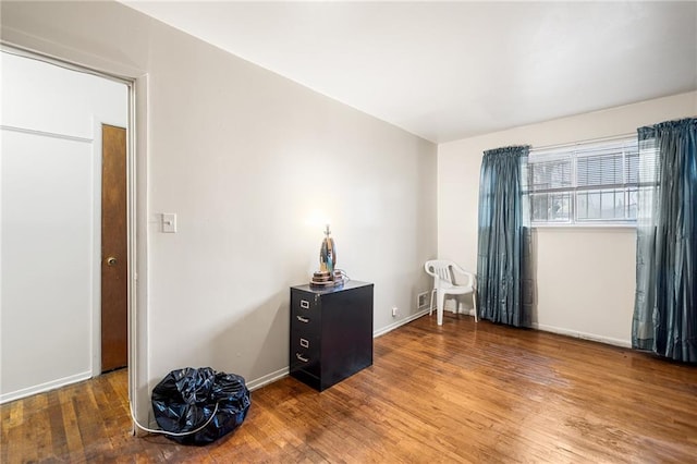 bedroom featuring wood-type flooring