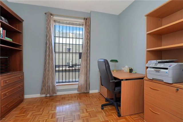 home office with light parquet flooring