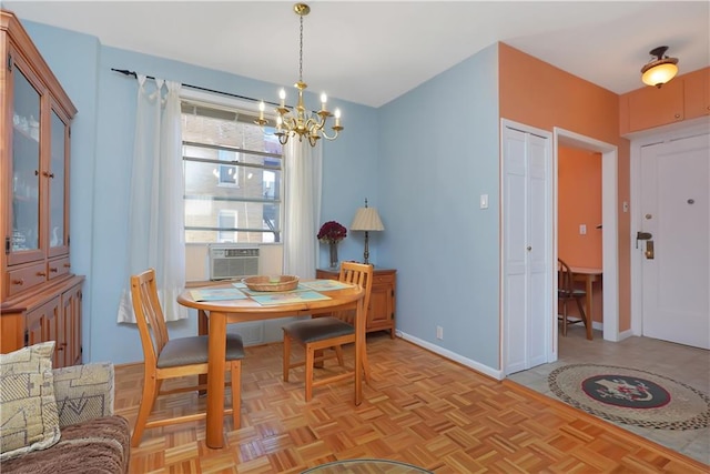 dining area with light parquet floors, cooling unit, and a notable chandelier