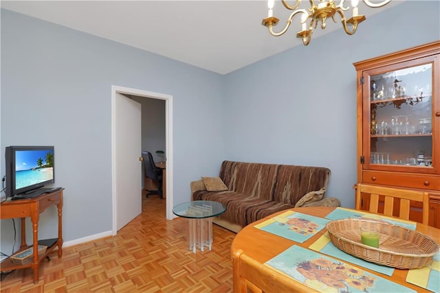 interior space with light parquet floors and a notable chandelier