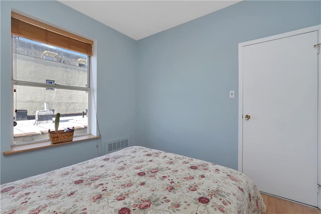 bedroom featuring light hardwood / wood-style floors