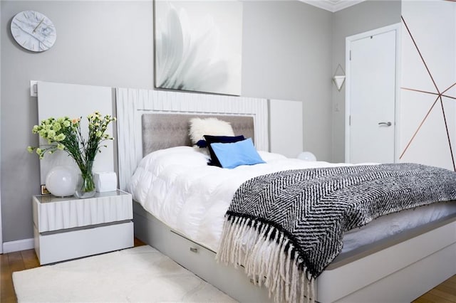 bedroom with wood-type flooring