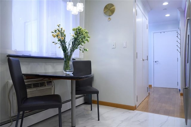 interior space featuring ornamental molding and light hardwood / wood-style flooring