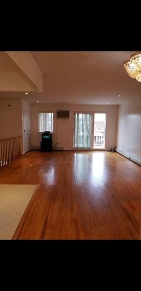 unfurnished living room featuring hardwood / wood-style floors