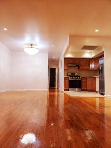 unfurnished living room with light wood-type flooring