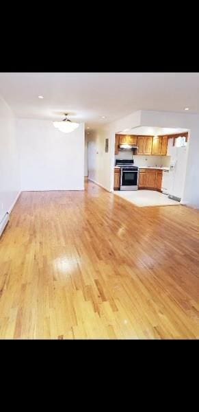 unfurnished living room featuring light wood-type flooring