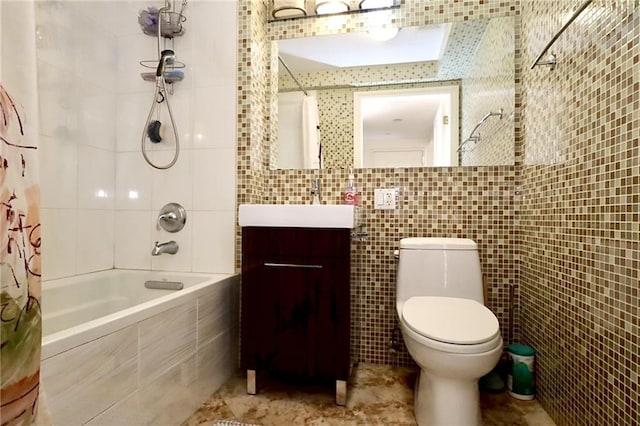 full bathroom featuring shower / tub combo with curtain, vanity, tile walls, and toilet