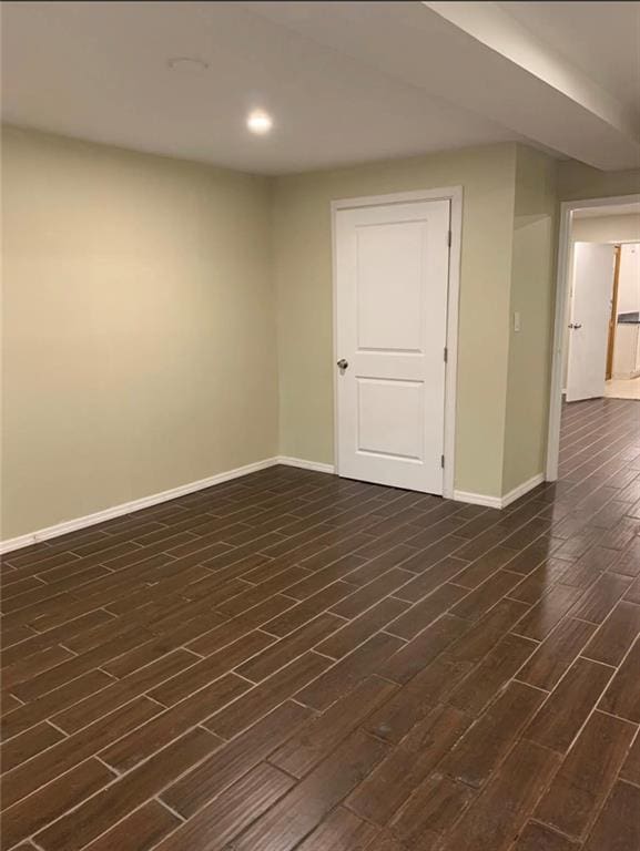 basement featuring dark wood-type flooring