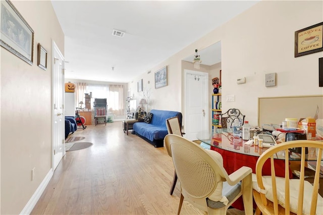 dining space featuring light hardwood / wood-style floors