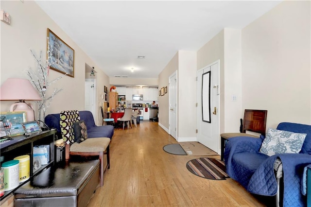 sitting room featuring light wood-type flooring