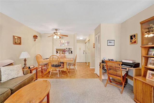 living room with light colored carpet and ceiling fan